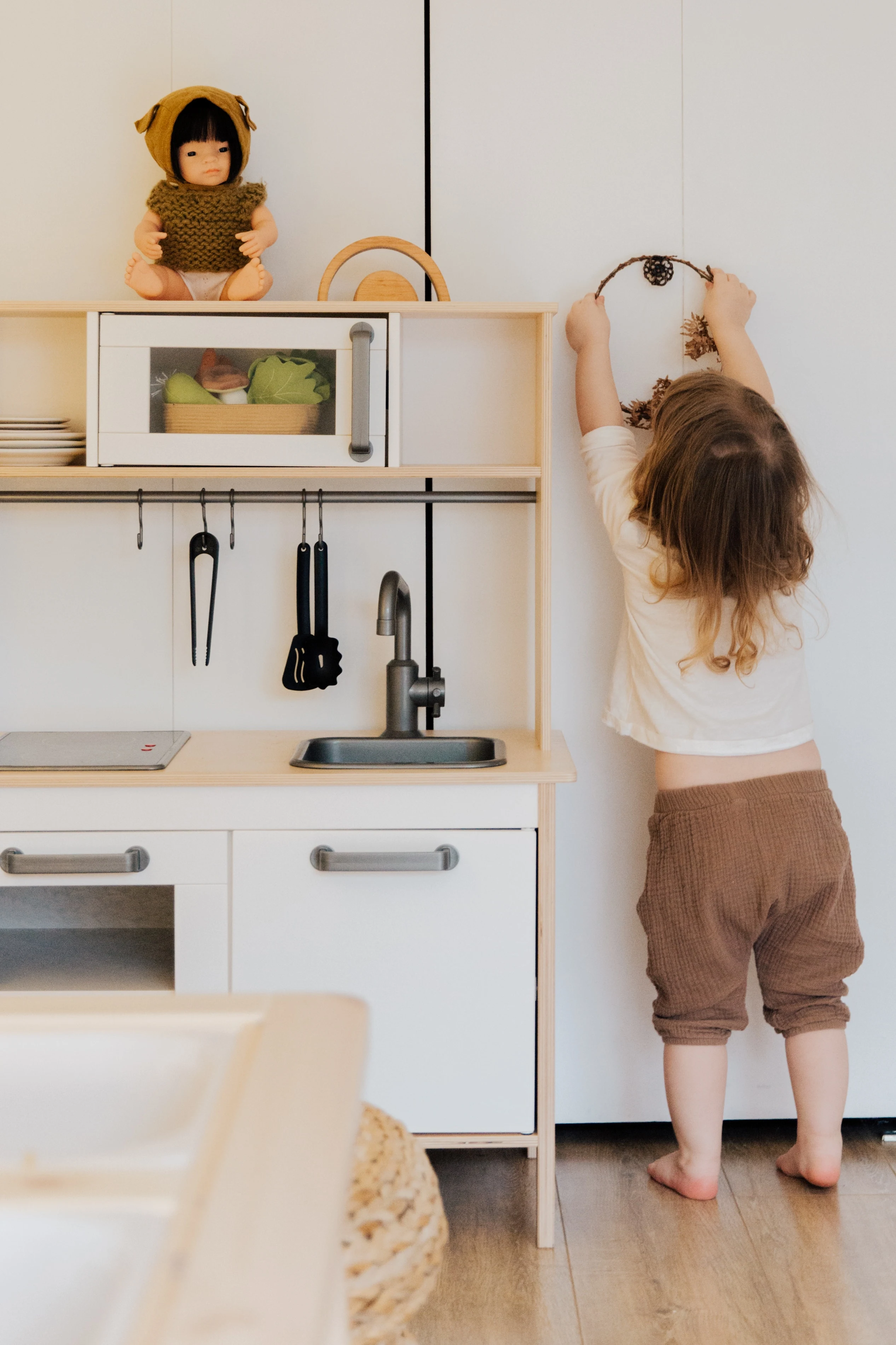 Practice Speech and Language Skills with a Kitchen Playset Young Girl Playing in Kitchen Playset