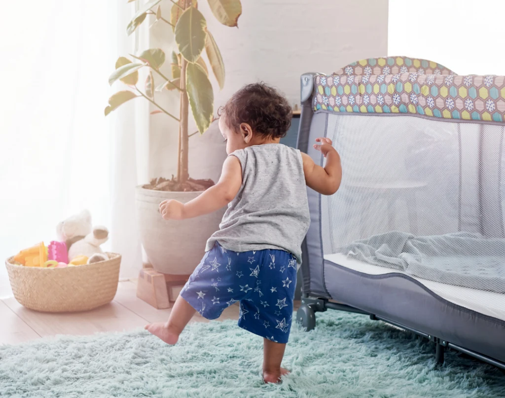 baby standing and walking independently