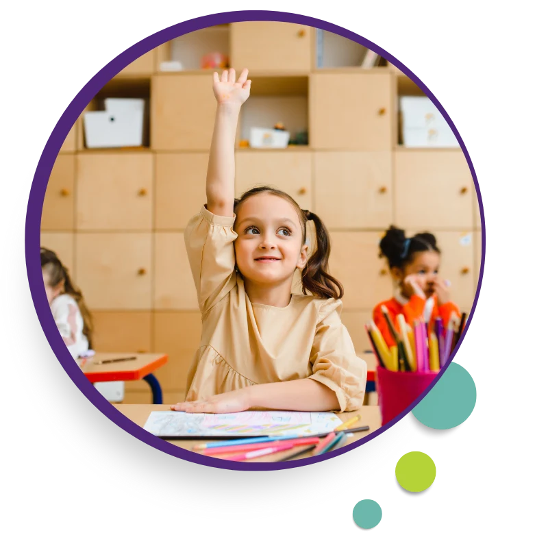 Girl raising her hand in a classroom
