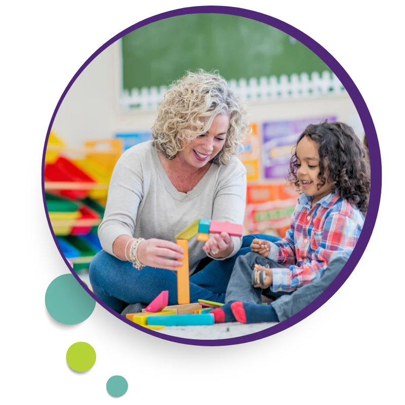 Therapist playing with a child with building toys